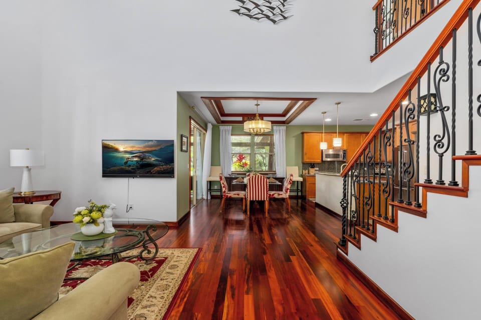 Open concept layout connects living room, dining, and kitchen