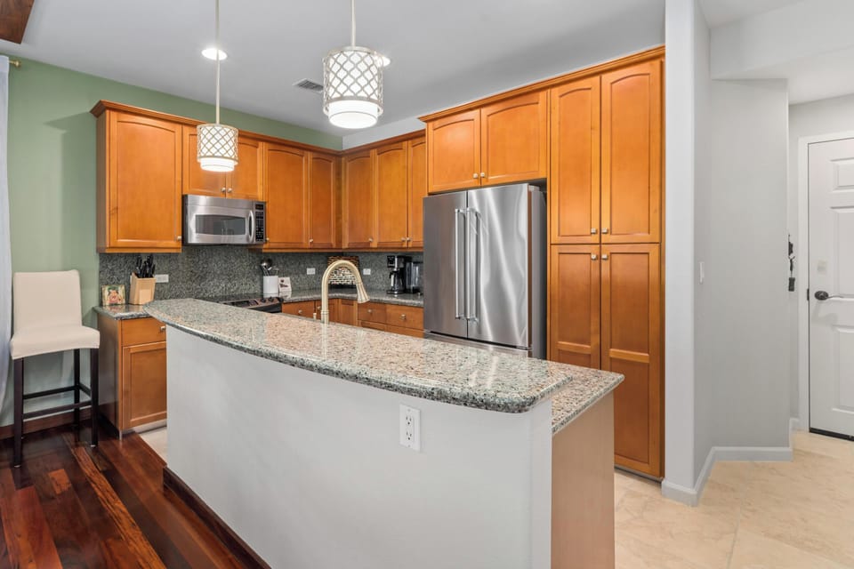 Full kitchen with granite counters and stainless steel appliances
