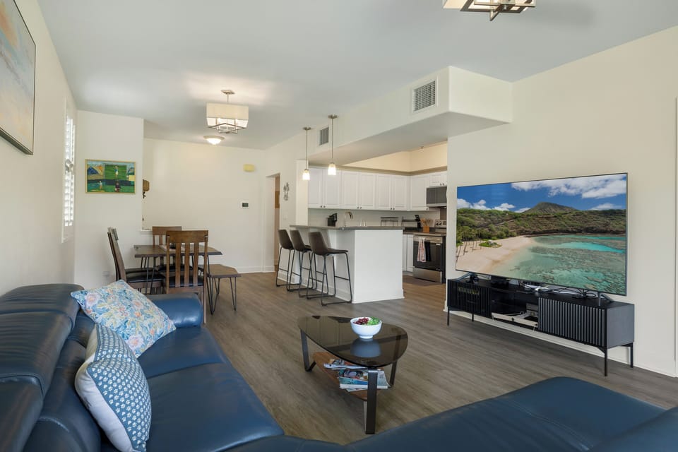Unwind in this bright open-concept space where you can cook in the modern kitchen while chatting with loved ones on the leather sofa.