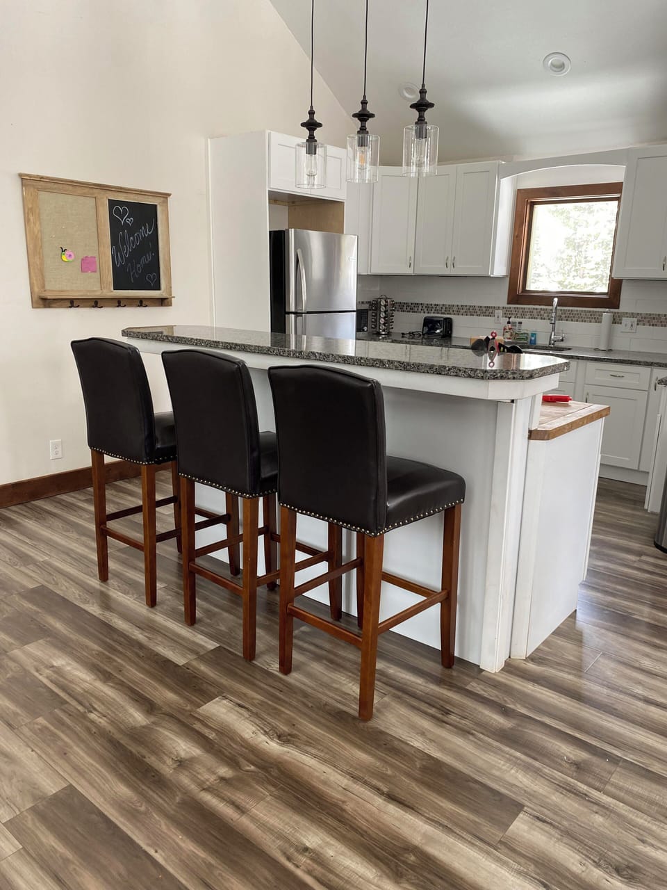Kitchen island with seating bar seating.