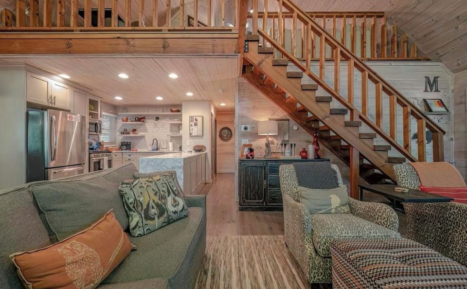 Living, kitchen and loft view 