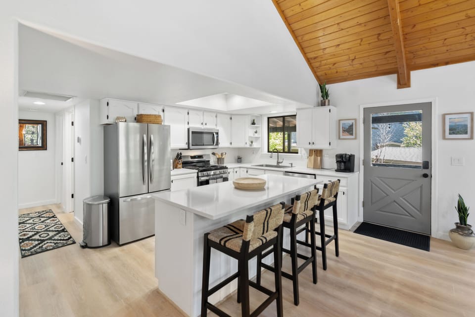 Kitchen 1 island for socializing and snacks.