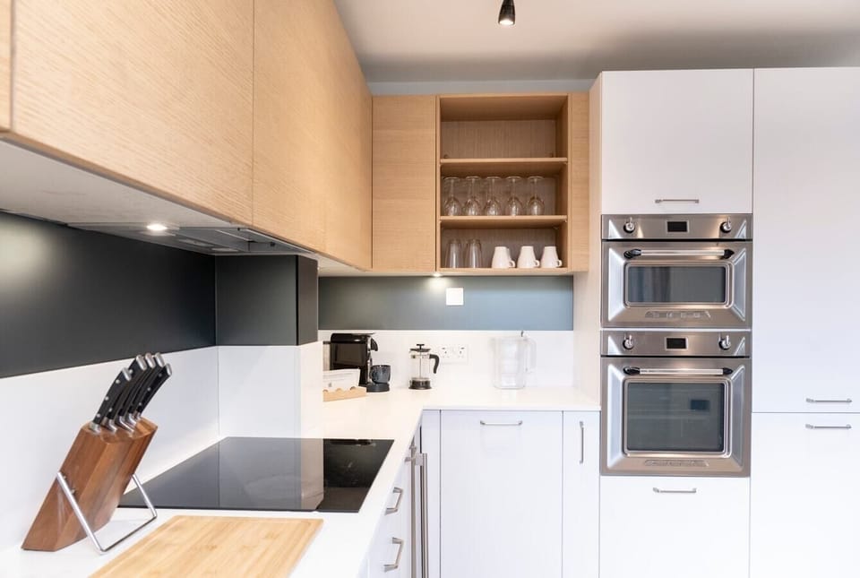 Fully equipped kitchen with amenities such as a dishwasher, Nespresso machine, and induction hob