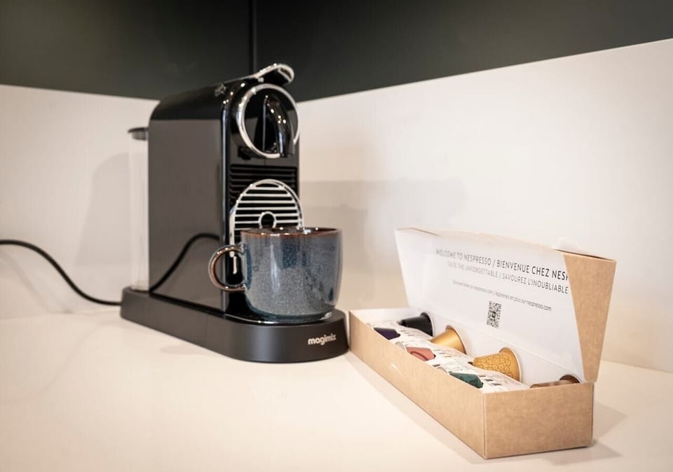 Fully equipped kitchen with amenities such as a dishwasher, Nespresso machine, and induction hob