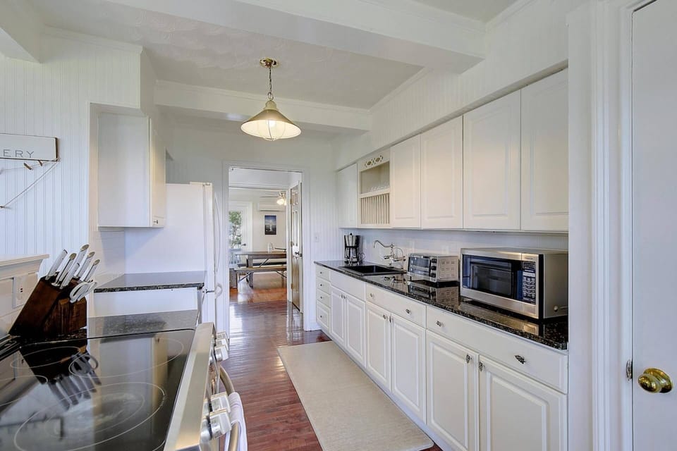 Turn into the kitchen which includes a new water filter on the sink for fresh drinkable water.