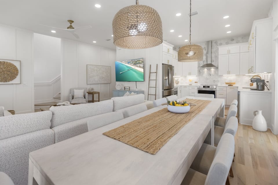 Gather around your elegant dining table where coastal textures meet modern comfort, creating the perfect space for memorable meals.