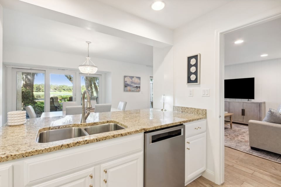 Updated Kitchen with Pristine White Cabinetry, Granite Countertops and Stainless Steel Appliances