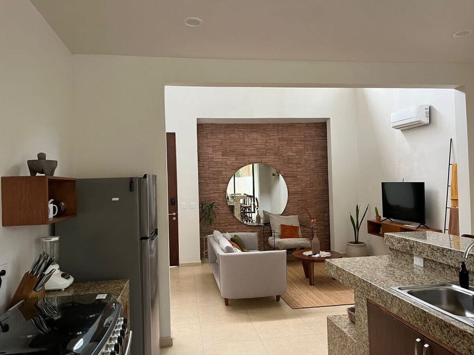 Enjoy luxury and comfort in our air-conditioned living room featuring LED ambiance—a perfect setting to unwind in style during your stay in Tulum