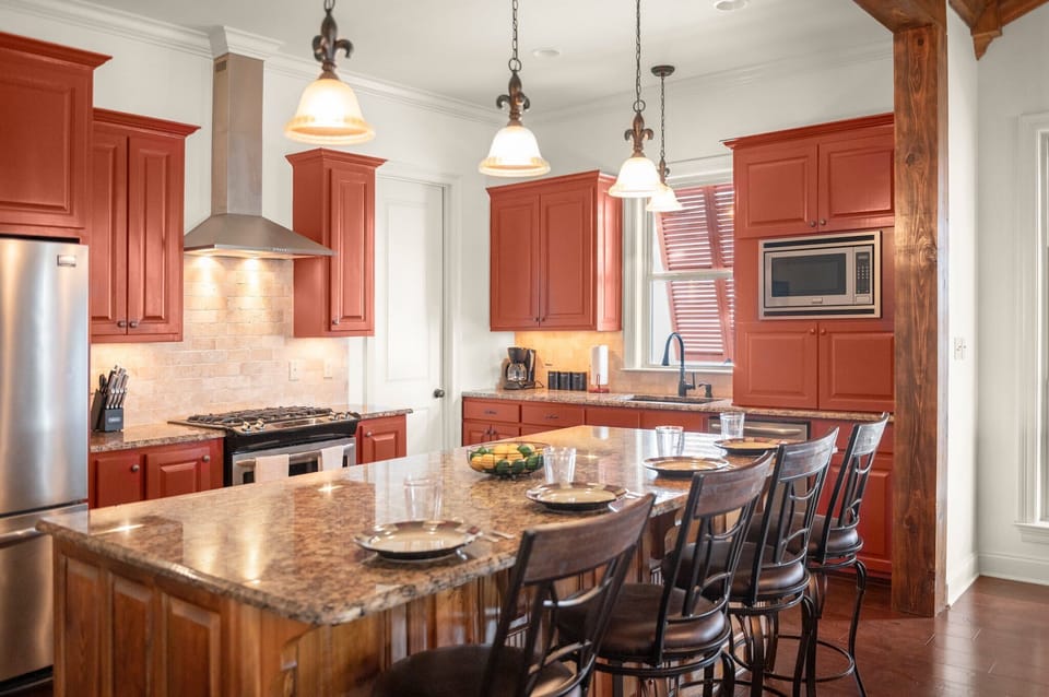 Fully stocked kitchen with island seating.