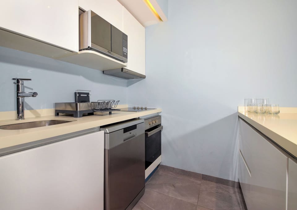 Take advantage of our fully functional kitchen space, featuring modern appliances for your convenience.