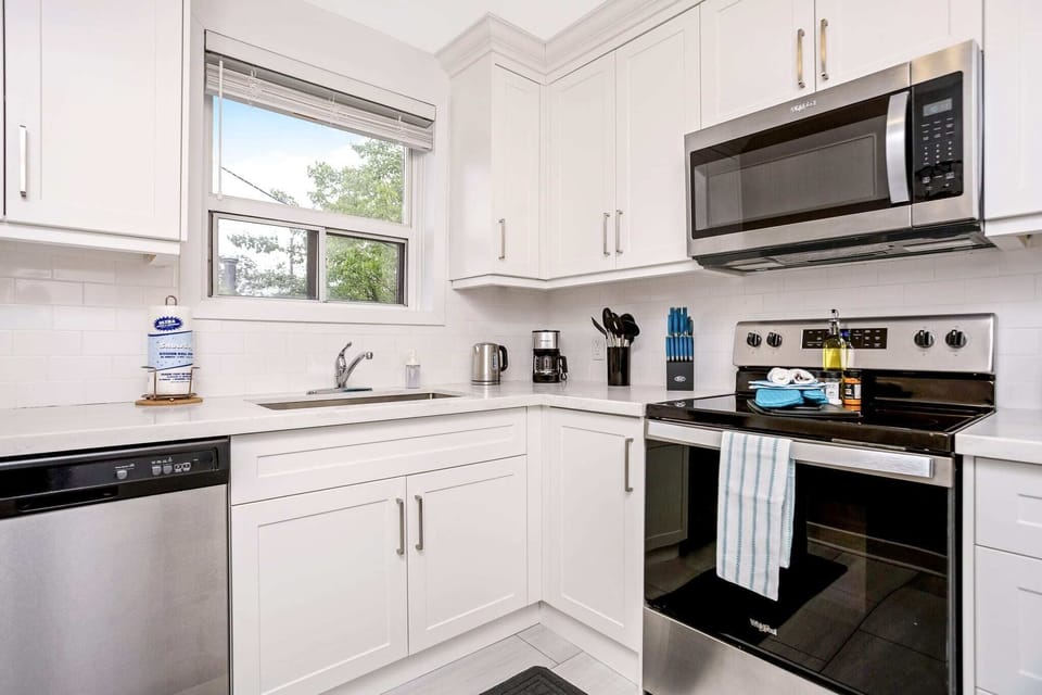 Fully equipped kitchen with a dishwasher and other appliances.