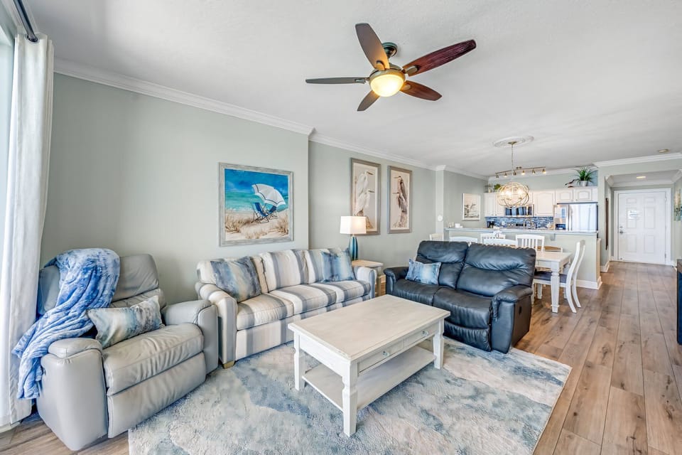 The living room offers ample, comfortable seating, a large flat screen television, and incredible views of the Gulf of Mexico.