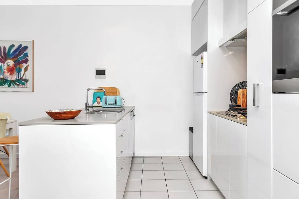 A modern kitchen with appliances and cooking utensils makes it easy to prepare meals at home.
