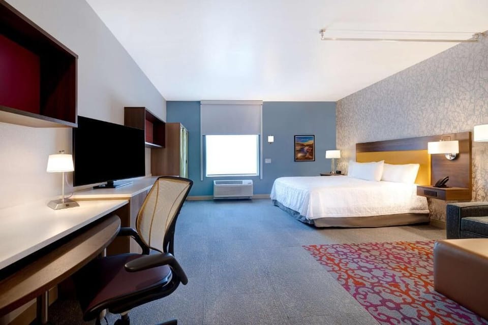 Recharge in a bright room with ample storage and desk space.
