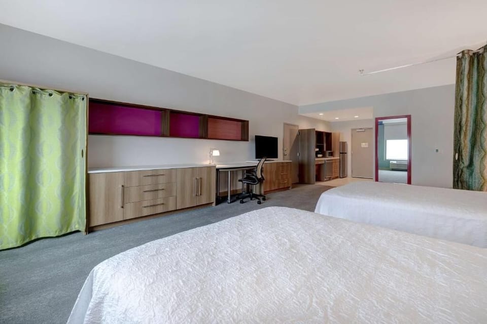 Arrive and relax in a spacious suite with two beds.