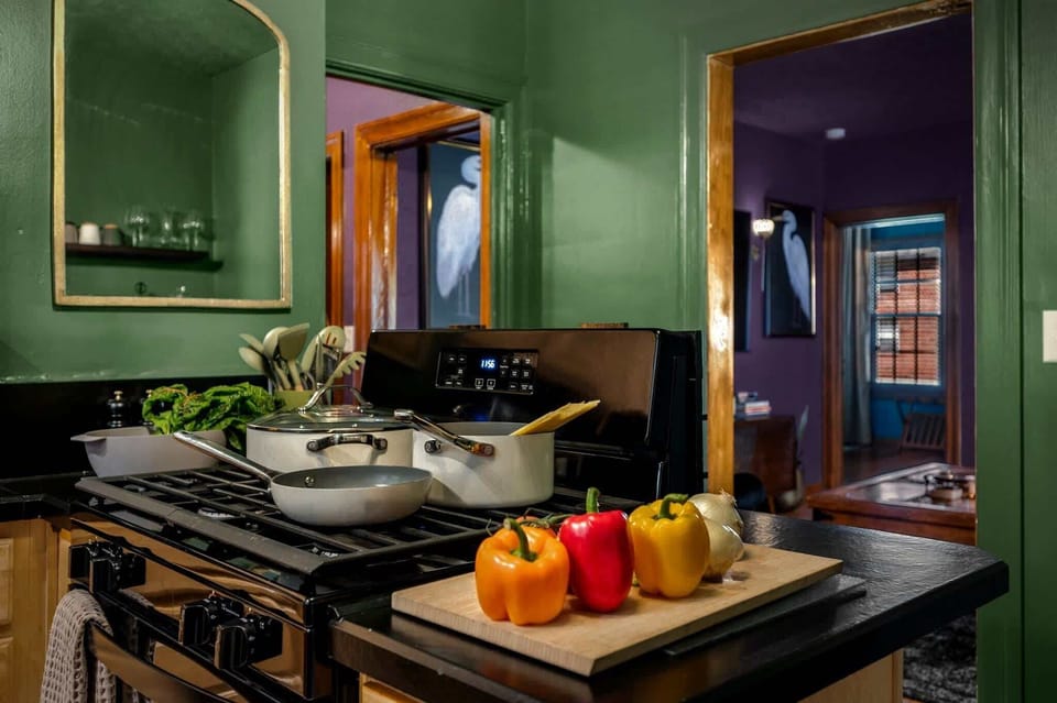 Stocked and ready for your home cooked meals at home. Gas range with multiple pots and pans. 