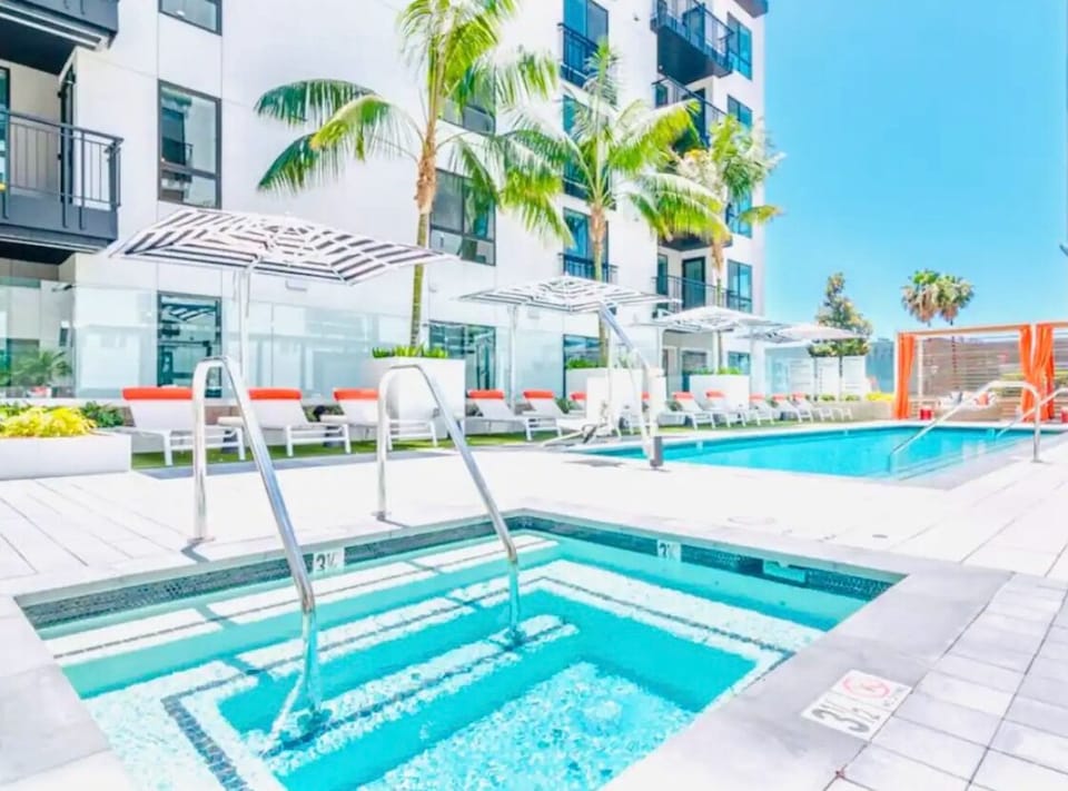 Sparkling pool and jacuzzi views from the private balcony.