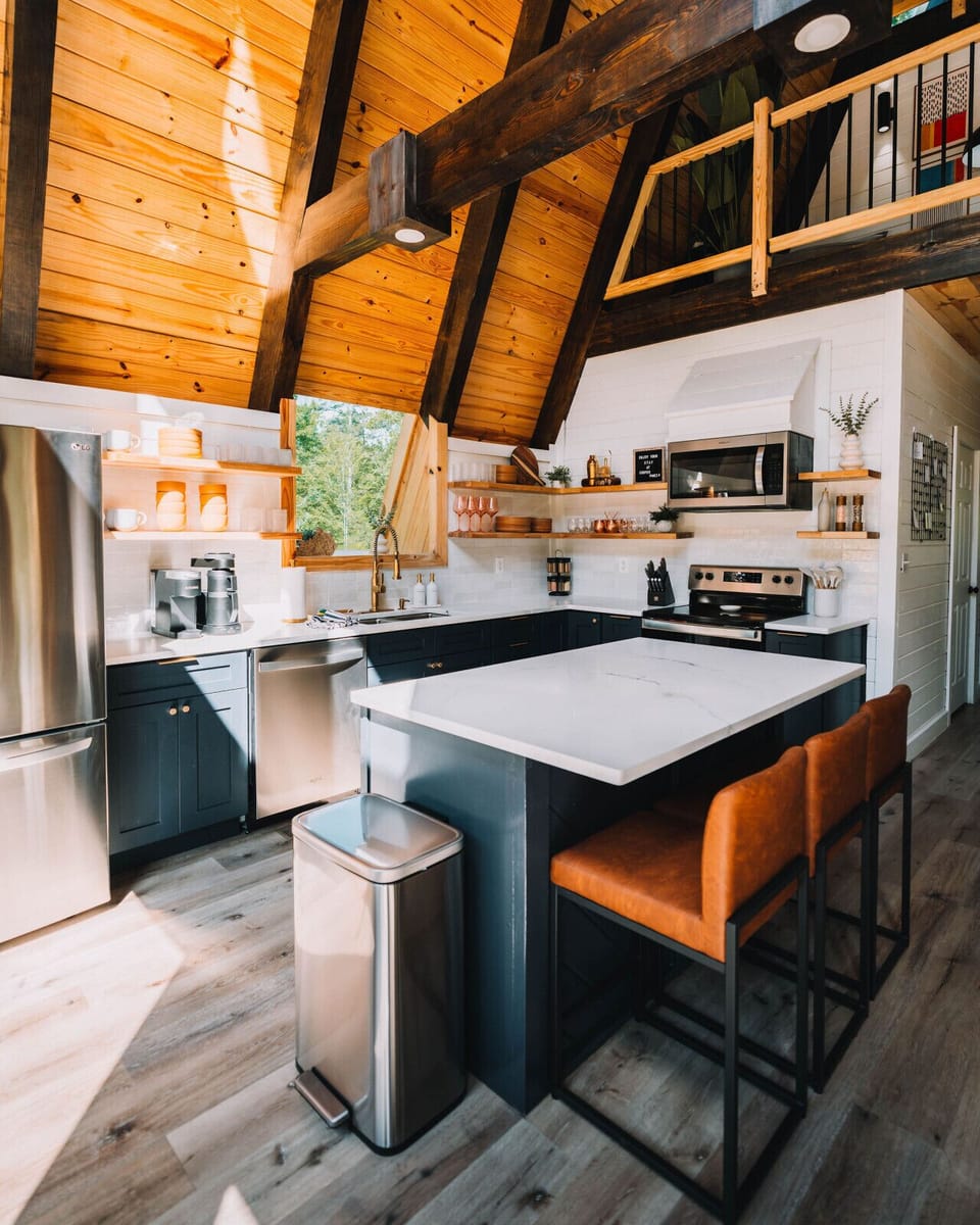 Fully stocked and beautifully designed — stainless appliances, brass fixtures, and a spacious island for morning coffee, late-night snacks, and everything in between.