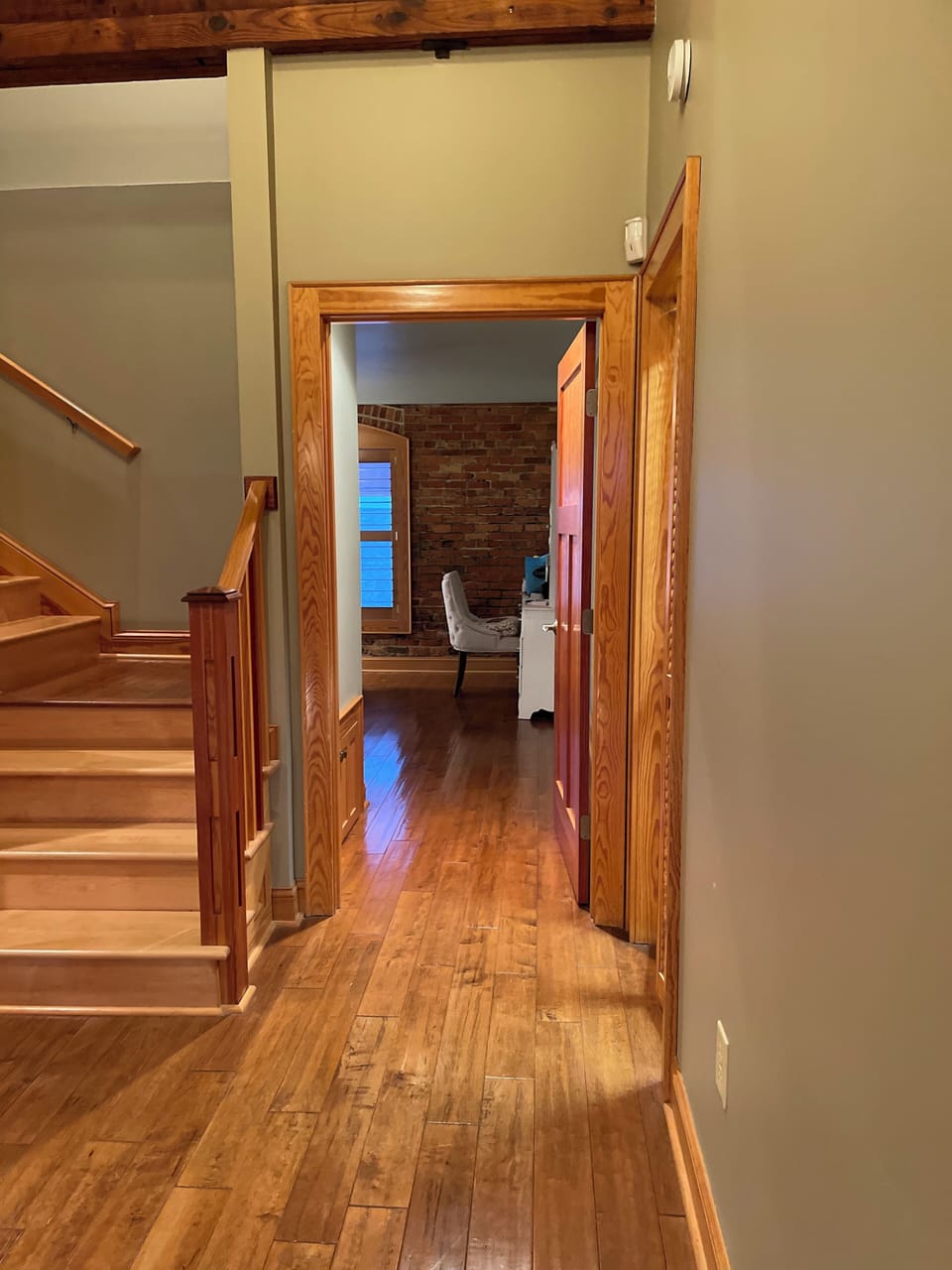 Hallway to first level master bathroom