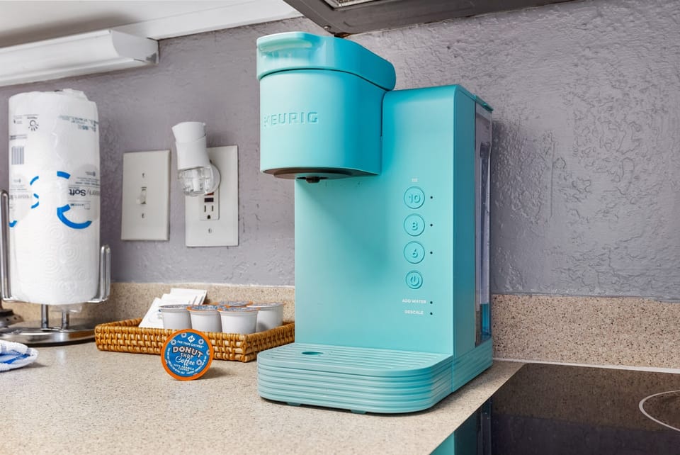 Start your day right with our cozy coffee station, fully stocked for your perfect brew!