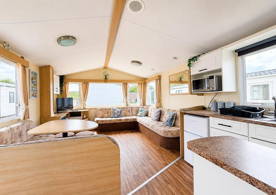 Discover the perfect staycation in the UK at Heacham Beach Holiday Park Norfolk, part of Parkdean Resort, where you can enjoy family caravan holidays with comfortable amenities, including a cosy bathroom in a caravan.