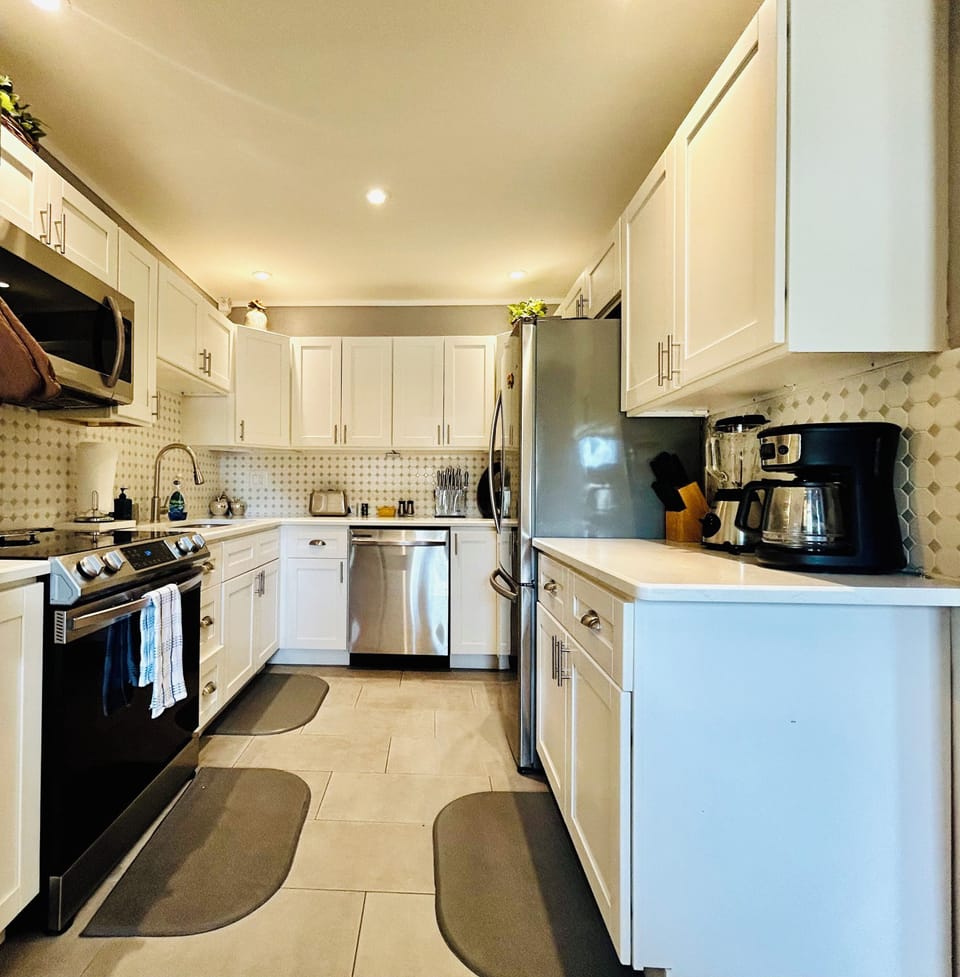 Our kitchen has:Refrigerator,oven,stove,microwave,coffee maker,blender & toaster