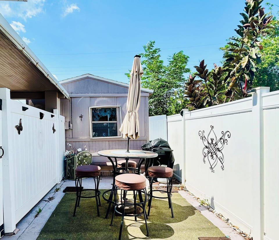 Our backyard is furnished w/ outdoor dining furniture & grill for your enjoyment