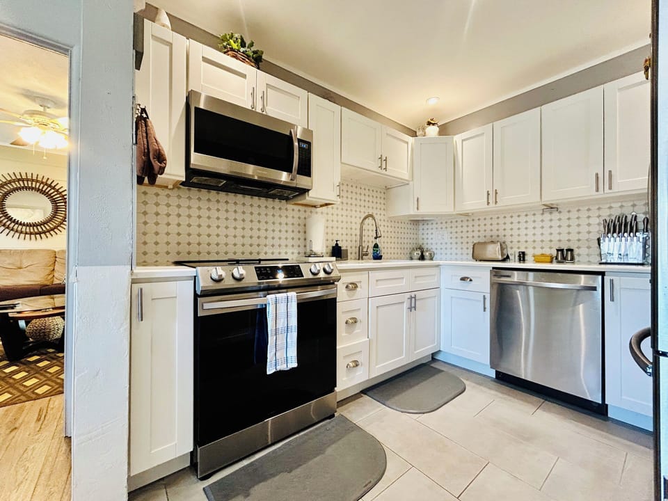 Our kitchen has:Refrigerator,oven,stove,microwave,coffee maker,blender & toaster
