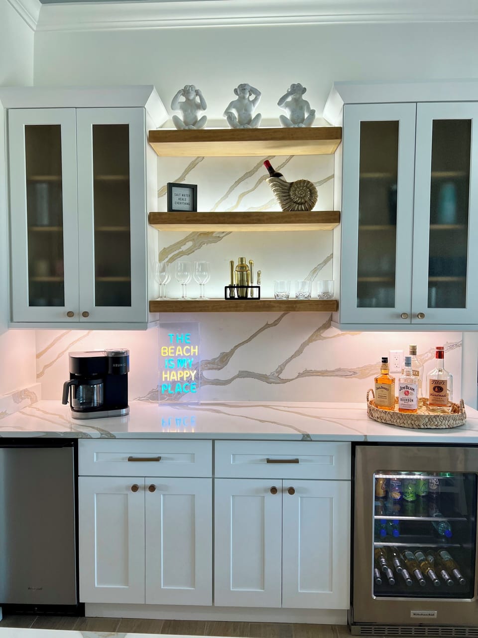 Drink station area with mini fridge and ice maker 