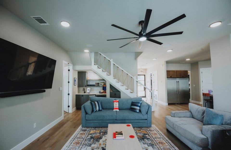 Living room downstairs and wet bar (includes ice maker and refrigerator)
