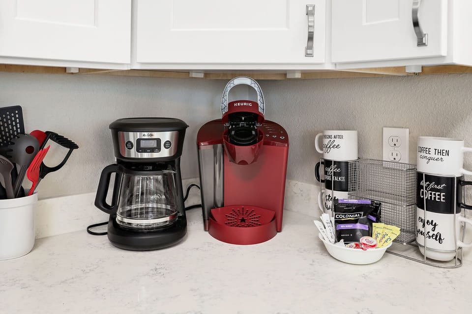 2 packs of coffee provided, along with individual creamer, sugar, and sweetener.  Bring your favorite K-Cups!
