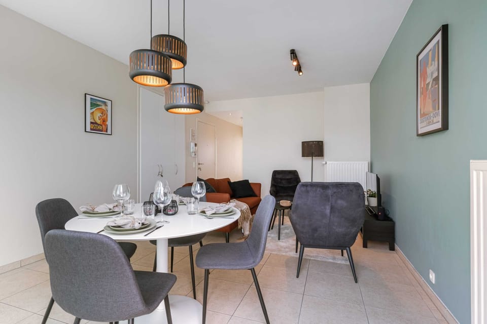 Light filled living area with dining table