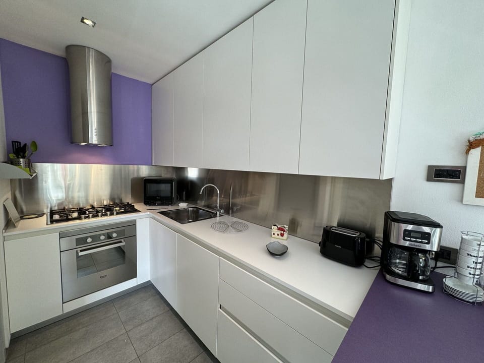 Countertop, Cabinetry, Kitchen Stove, Kitchen, Kitchen Appliance, Gas Stove, Stove, Flooring, Home Appliance