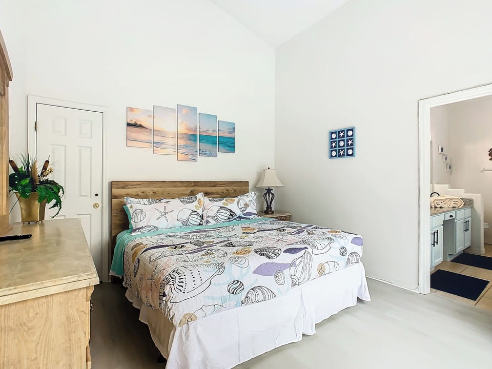 - Serene bedroom with king size bed and ocean themed bedding for a relaxing escape
- Soft beach artwork and starfish details create a calming, breezy atmosphere
- Ensuite bathroom access adds extra privacy and convenience for guests
