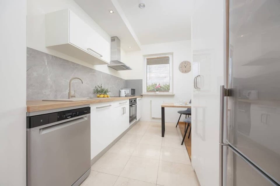 Bright kitchen with cooking utensils.