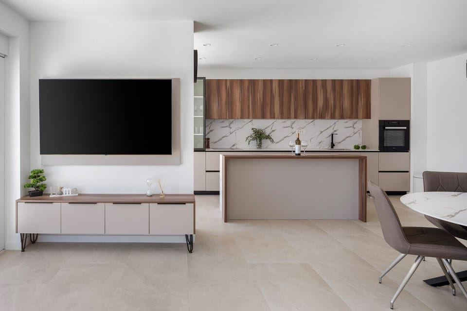 Living room, dining area, and kitchen are all connected by an open-plan layout
