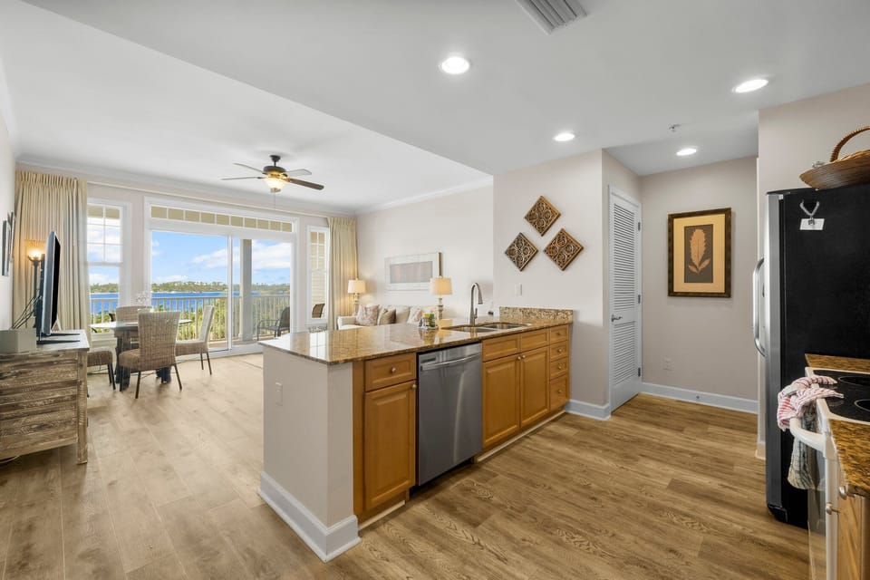 The fully equipped kitchen features granite countertops, stainless appliances and has everything you need to prepare meals for family & friends.