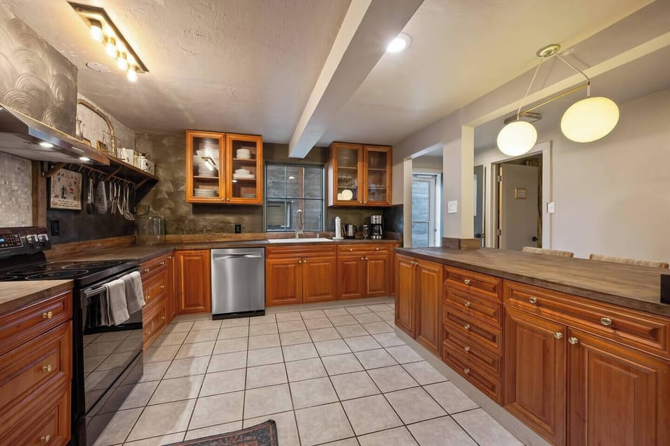 Enjoy cooking in the large, well stocked kitchen with plenty of counter space and bar seating