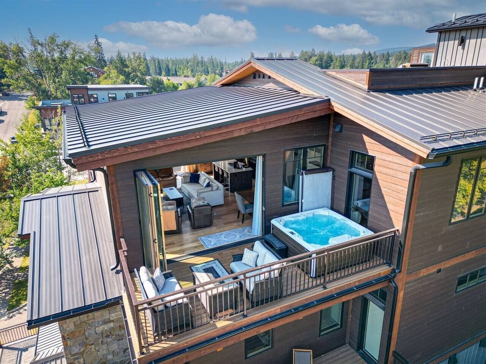 Bring the beauty of the outdoors within as you open the accordion doors to the private patio with hot tub.