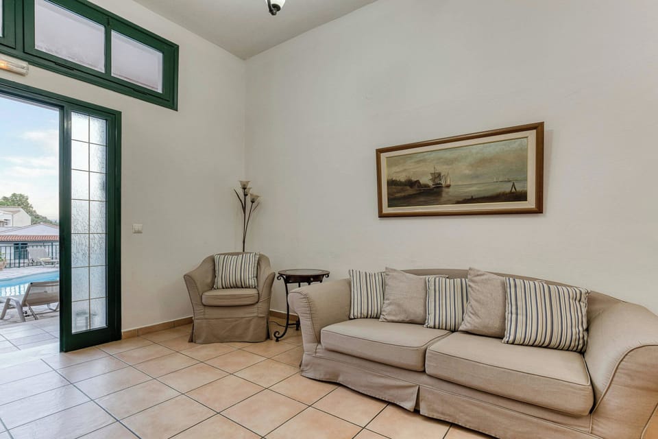 "Spacious and cozy bedroom with natural light and comfortable bedding for a restful sleep."
