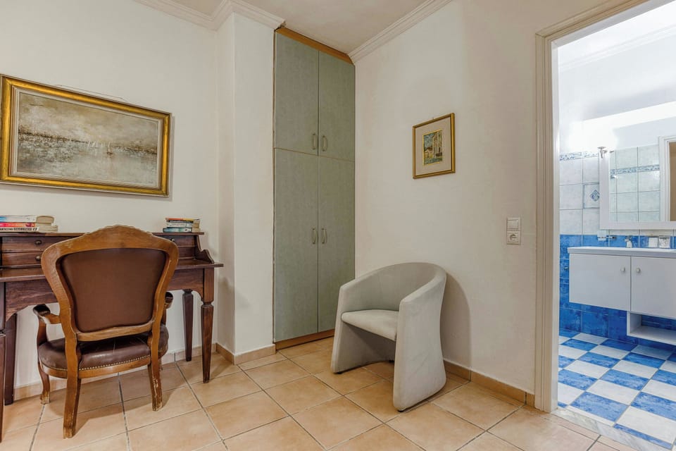 "A charming corner with a comfortable chair and classic decor on the first floor.."