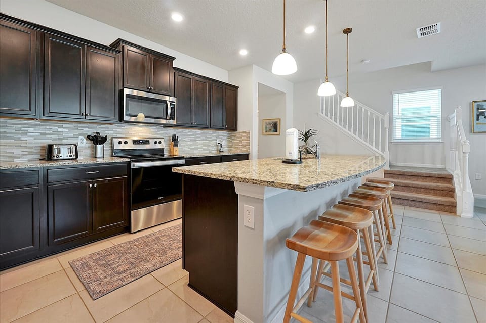 The kitchen has a large and spacious countertop for a delicious breakfast.