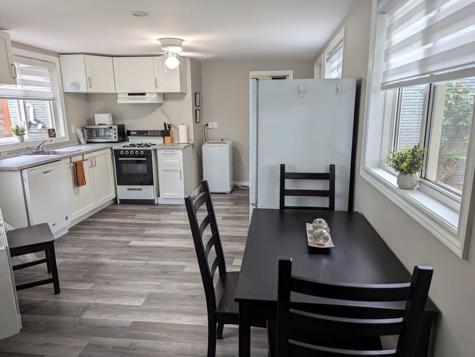 Kitchen also includes a laundry washer and dryer.