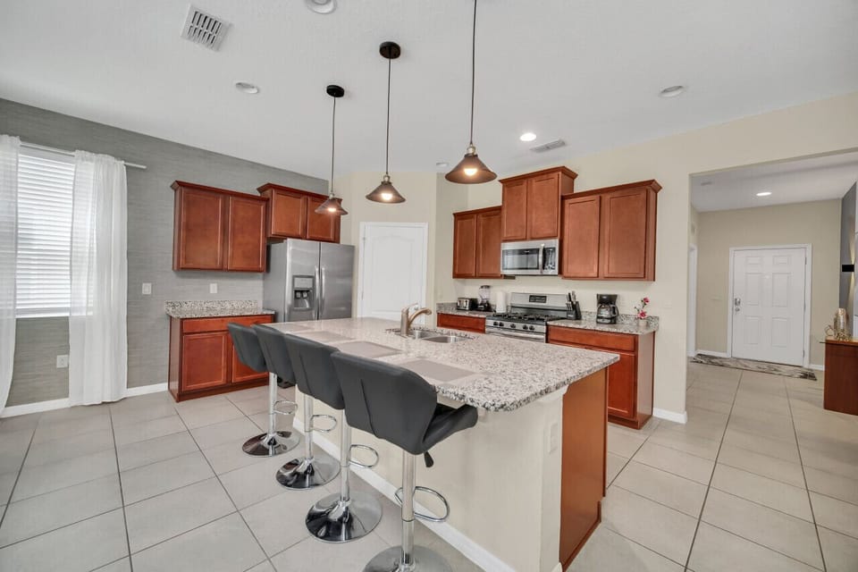 Our modern kitchen with stainless steel appliances and granite countertops, perfect for preparing delicious meals.