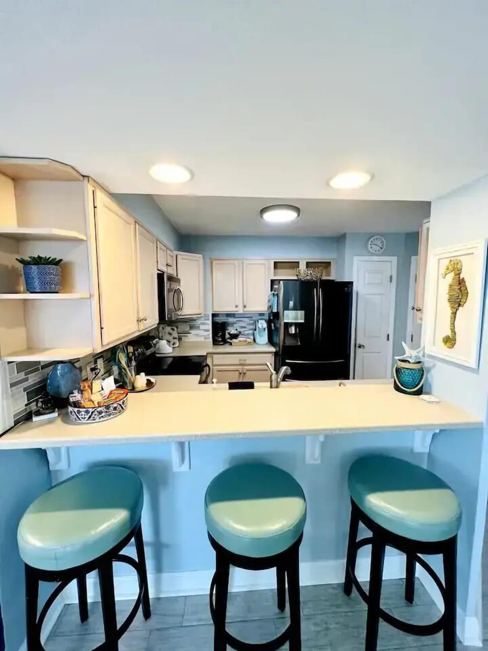 Breakfast bar (3 stools) view of kitchen 