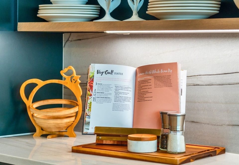 The combination of sleek cabinets and open shelving makes this kitchen nook a practical and beautiful space.
