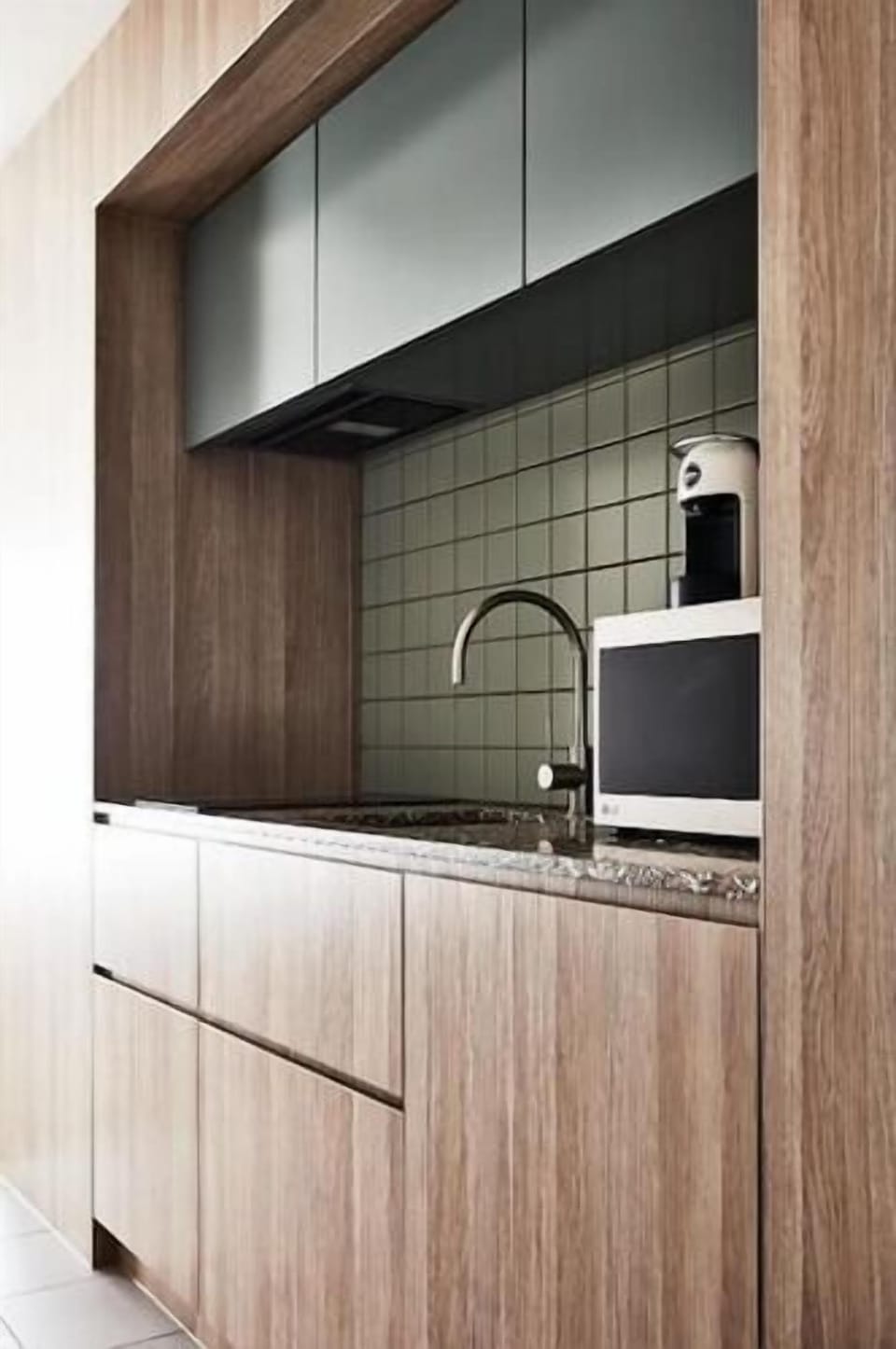 Kitchenette complete with fridge and dishwasher.