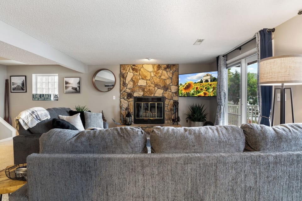 Cozy up by the fire or with a great flick in the family room with ample seating and beautiful lake views.