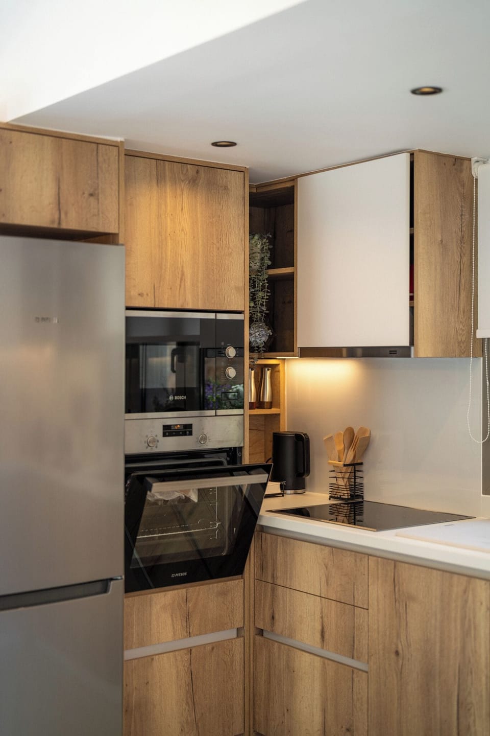 Open plan fully equipped kitchen - living area with direct access to the pool.