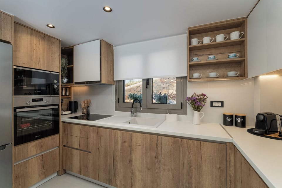 Open plan fully equipped kitchen - living area with direct access to the pool.